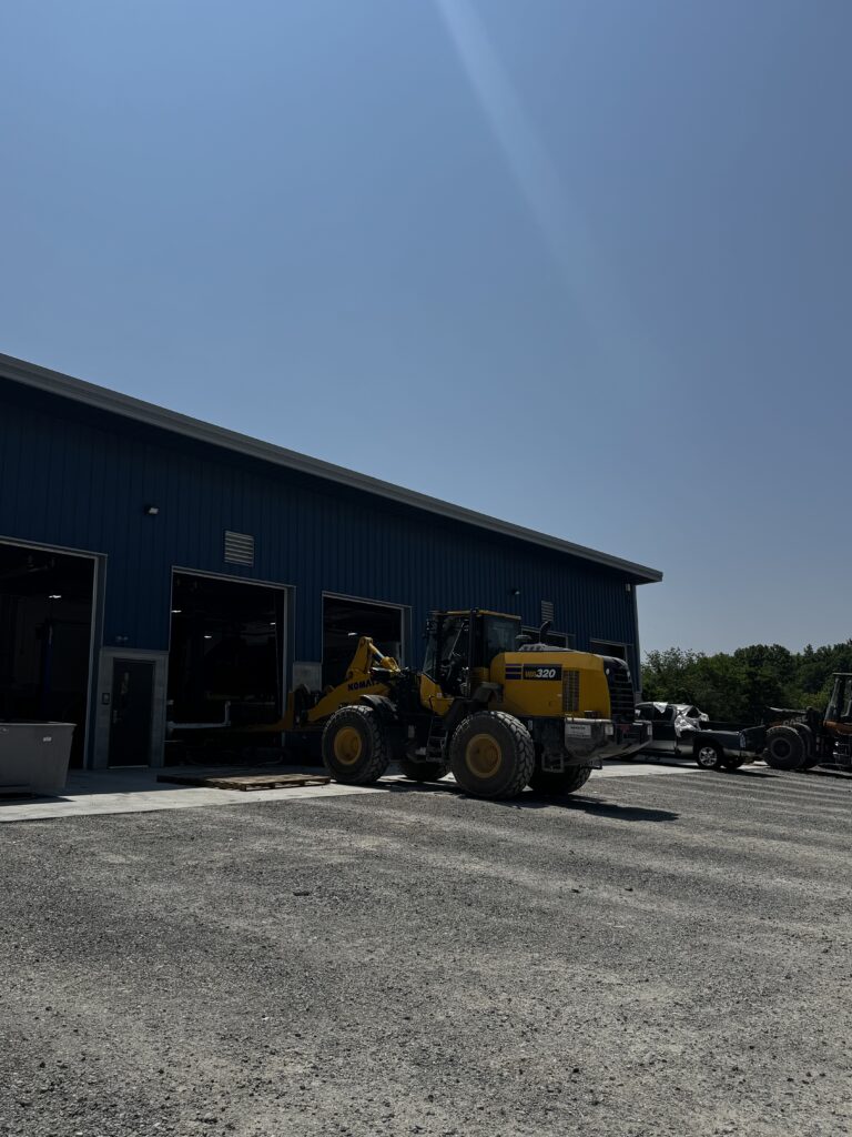 Komatsu Loader in front of Production Warehouse